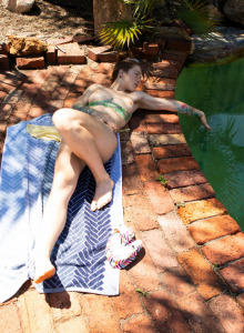 Hairy Pixie Faye with puffy nipples goes nude by the garden pool